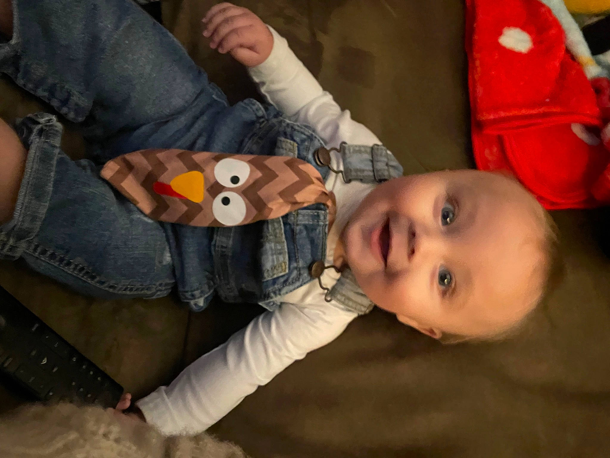 Devon is registered to the contest to win money with this photo: baby, baby_toddler_clothing, cheek, child, denim, fun, happy, mouth, nail, nose, outerwear, pattern, person, sitting, skin, smile, stuffed_toy, thumb, toddler, toy