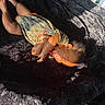 baby, blanket, camo_clothing, child, crying, expression, fabric, face, foot, hair, hand, head, indoor, infant, orange_text, person, shadow, skin, sunlight, texture