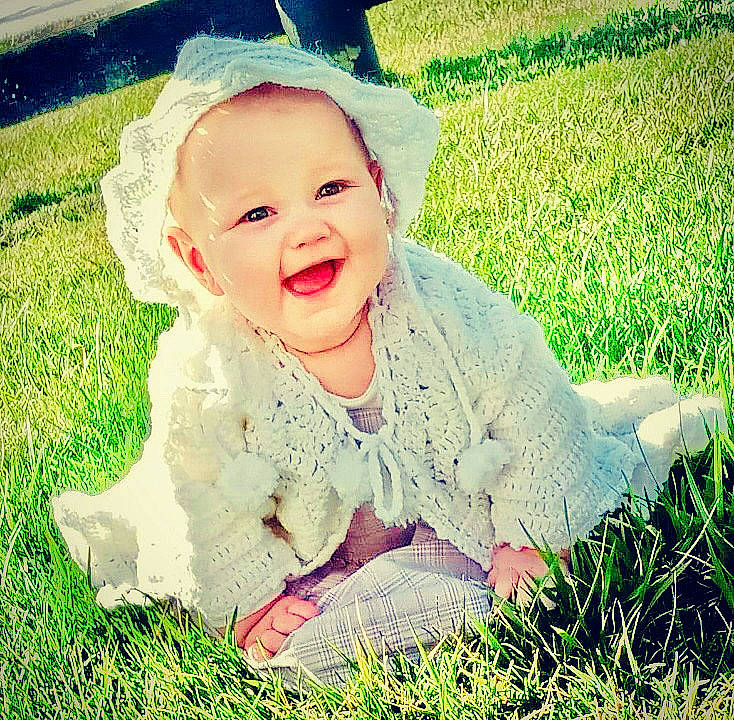 Lakynn is registered to the contest to win money with this photo: art, baby, baby_laughing, baby_toddler_clothing, child, costume_hat, fun, gesture, grass, grass_family, grassland, happy, headpiece, lawn, meadow, people_in_nature, person, plant, sitting, smile