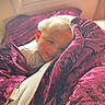 Amiracle is registered to the contest to win money with this photo: baby, bed, bedroom, blanket, couch, cushion, face, furniture, happy, head, homedecor, indoors, person, photography, portrait, quilt, room, sleeping, smile, velvet