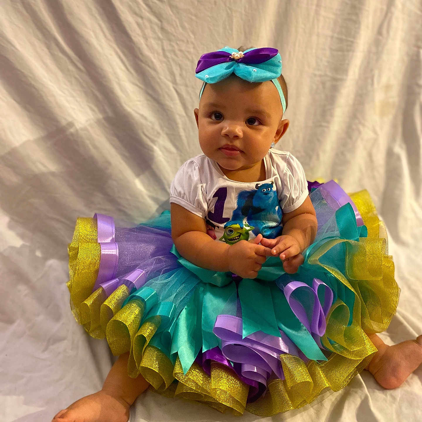 Amiracle joined the competition — help win amazing prizes! accessories, baby, clothing, costume, dress, face, flower, formalwear, hat, head, jewelry, necklace, person, photography, plant, portrait, purple, sitting, skirt, toy