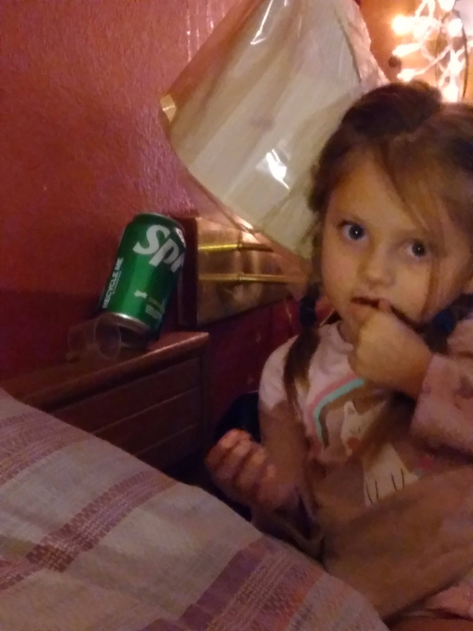 Addilynn is registered to the contest to win money with this photo: baby, child, comfort_food, drink, finger, flooring, fun, hand, happy, lamp, person, room, selfie, sitting, square, table, tableware, thumb, tin_can, toddler