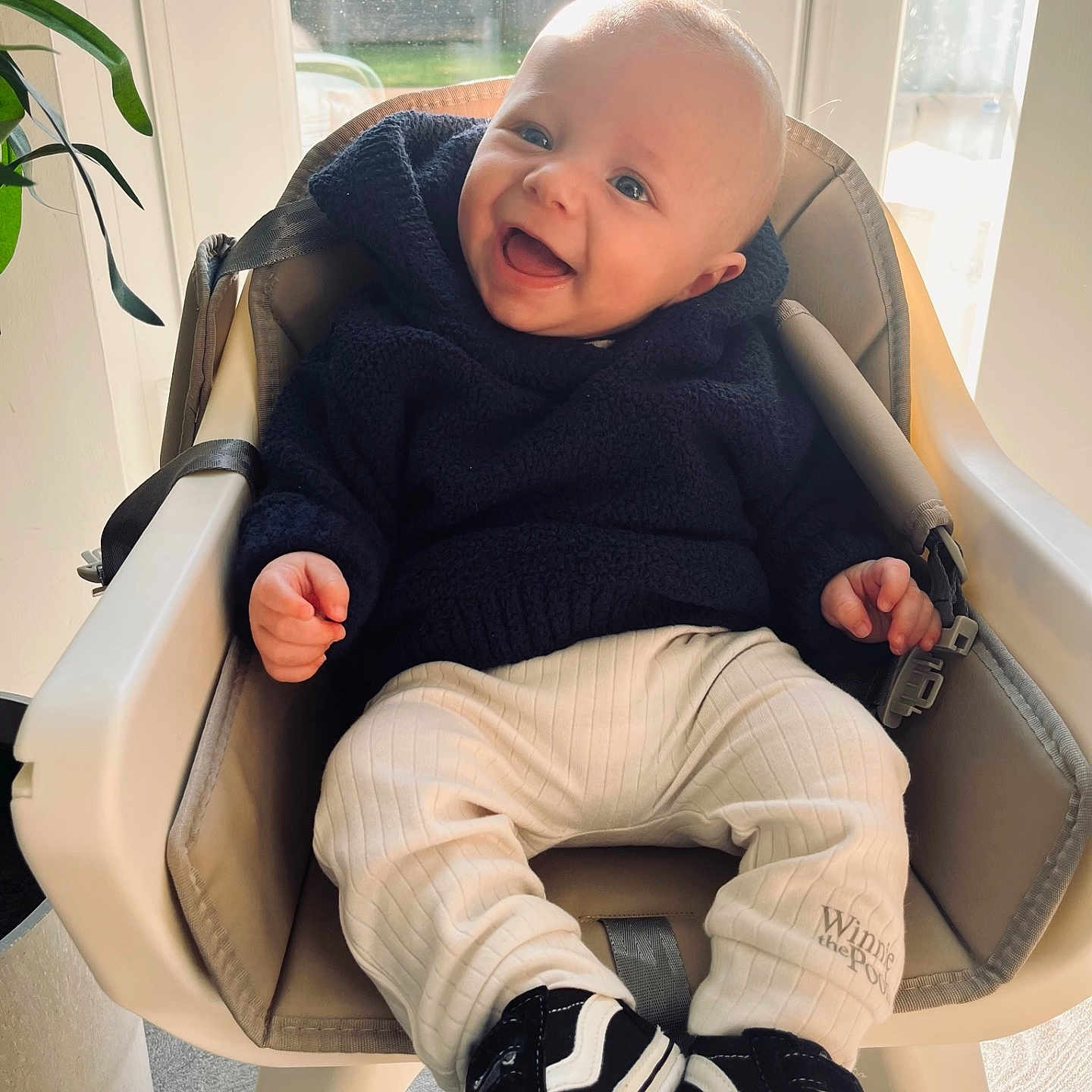 Carter joined the competition — help win amazing prizes! baby, babylaughing, chair, clothing, coat, face, footwear, furniture, happy, head, highchair, jeans, laughing, pants, person, photography, portrait, shoe, sitting, smile