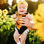 baby, infant, child, sunflower, headband, outdoor, garden, flower, smiling, person, hands, summer, nature, greenery, sunlight, socks, cute, happy, holding, portrait