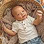 baby, infant, basket, blanket, knit, white_shirt, denim_shorts, raised_arm, cute, smiling, face, skin, person, child, cozy, texture, woven, hands, blue_eyes, portrait