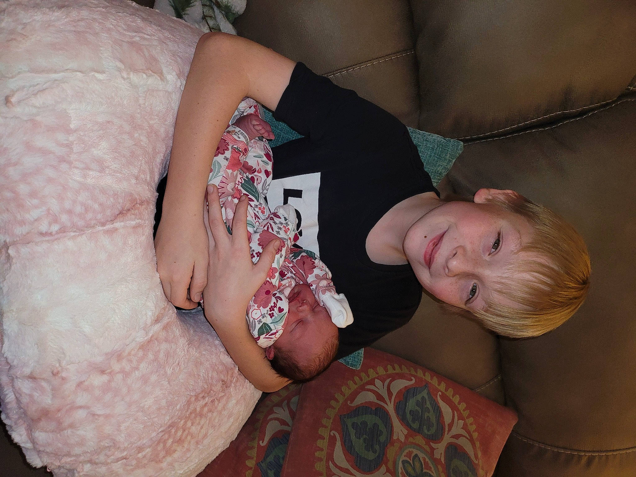 Indiana is registered to the contest to win money with this photo: baby, chest, comfort, couch, elbow, finger, foot, human_leg, joy, knee, lap, leg, nail, person, skin, sock, stomach, textile, thigh, toddler