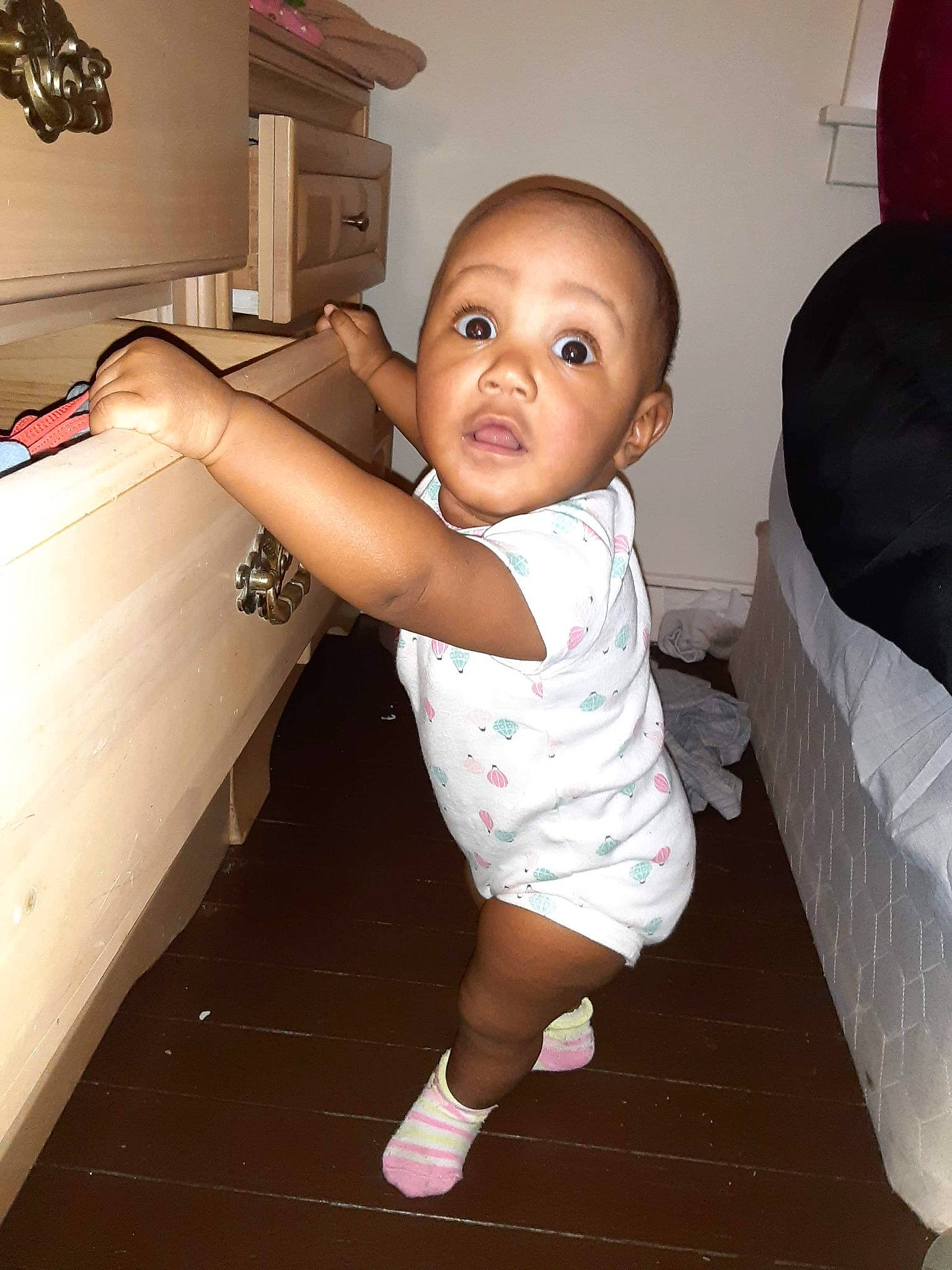 Kathryn is registered to the contest to win money with this photo: baby, baby_toddler_clothing, child, comfort, elbow, finger, flash_photography, floor, flooring, fun, gesture, happy, human_leg, joint, person, room, skin, standing, surprise, thumb