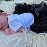 Genevieve joined the competition — help win amazing prizes! baby, sleeping, infant, white_shirt, black_skirt, bow, headband, orange_flowers, fluffy_rug, outdoor, grass, peaceful, cute, portrait, resting, small_hands, newborn, soft_texture, fashion, child