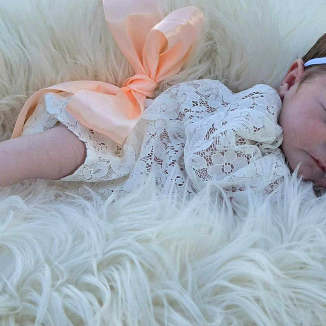 Genevieve is registered to the contest to win money with this photo: baby, newborn, sleeping, lace, headband, bow, peach, blanket, fluffy, soft, cozy, infant, cute, portrait, resting, child, peaceful, white, delicate, tender