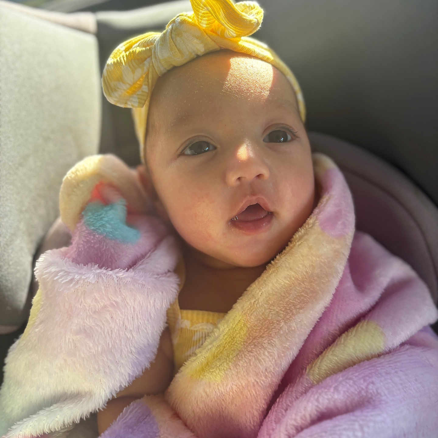 Lianna joined the competition — help win amazing prizes! baby, blanket, bonnet, cap, car, car_interior, carseat, clothing, cushion, face, happy, hat, head, homedecor, newborn, person, photography, portrait, smile, towel