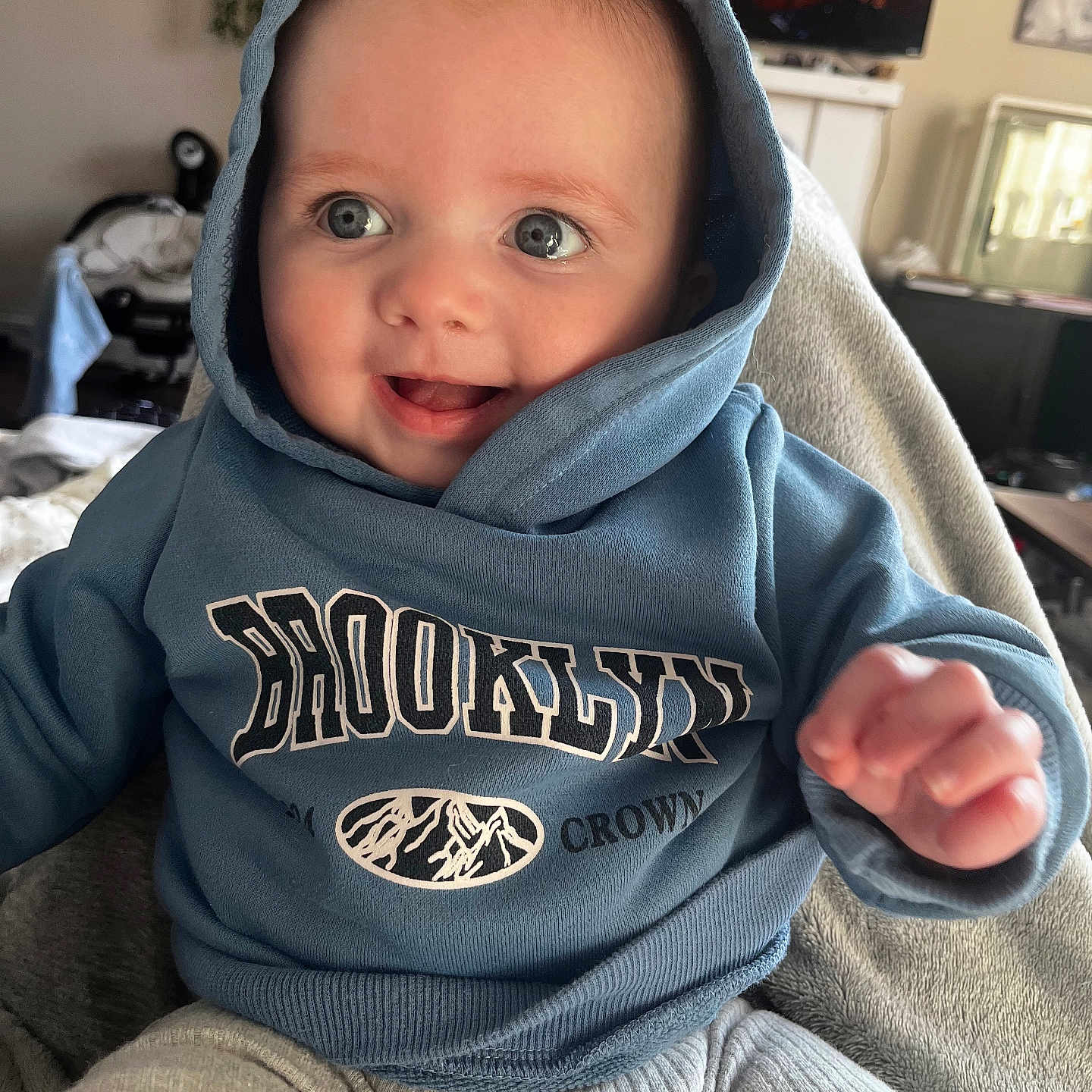 Hudson joined the competition — help win amazing prizes! baby, bodypart, clothing, coat, face, finger, happy, hat, head, hood, hoodie, jacket, knitwear, pants, person, photography, portrait, smile, sweater, sweatshirt