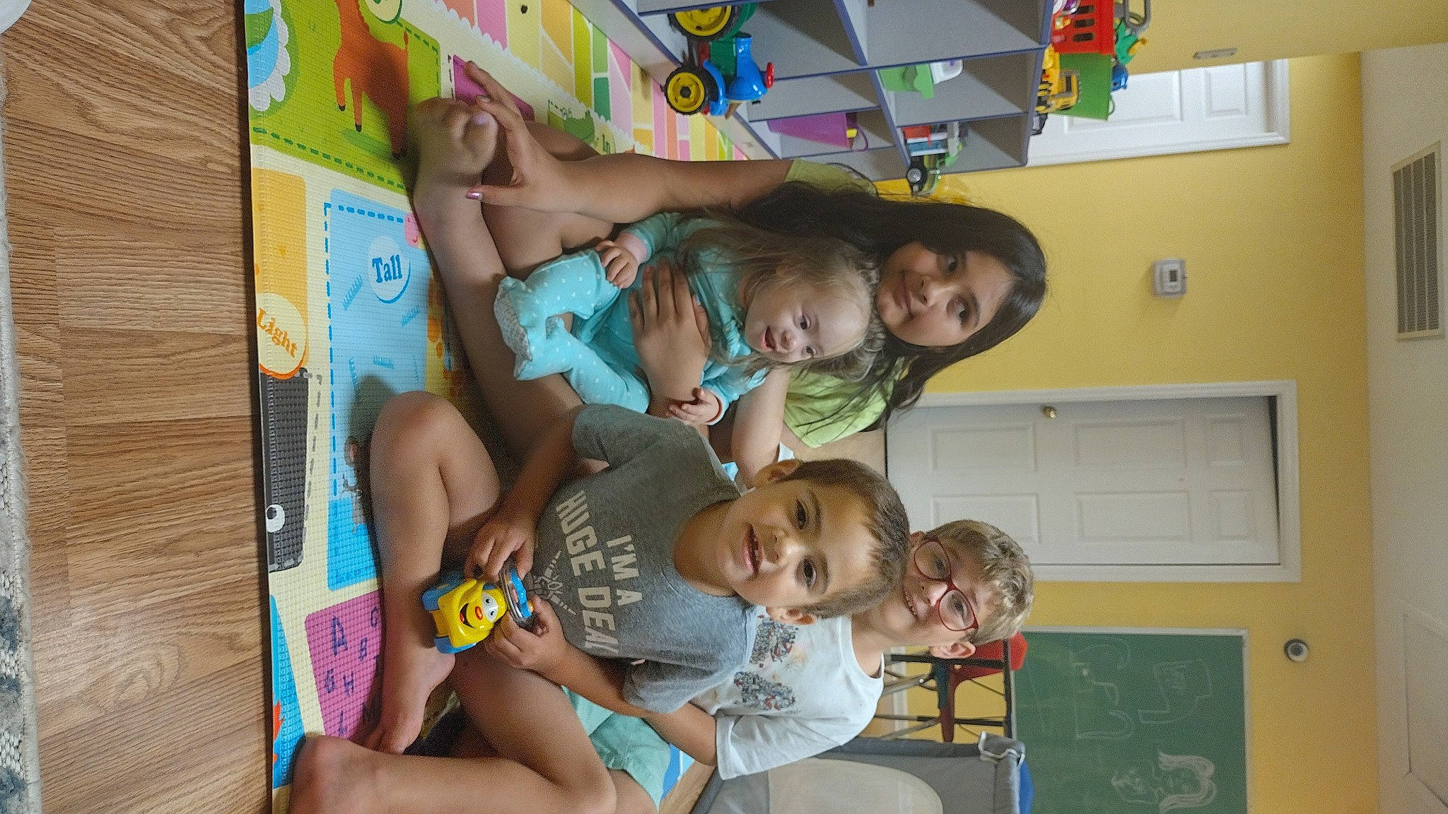 Aurora is registered to the contest to win money with this photo: child, event, fun, happy, joy, kindergarten, leisure, party, party_supply, person, play, publication, room, sharing, shorts, t_shirt, thigh, toddler, visual_arts