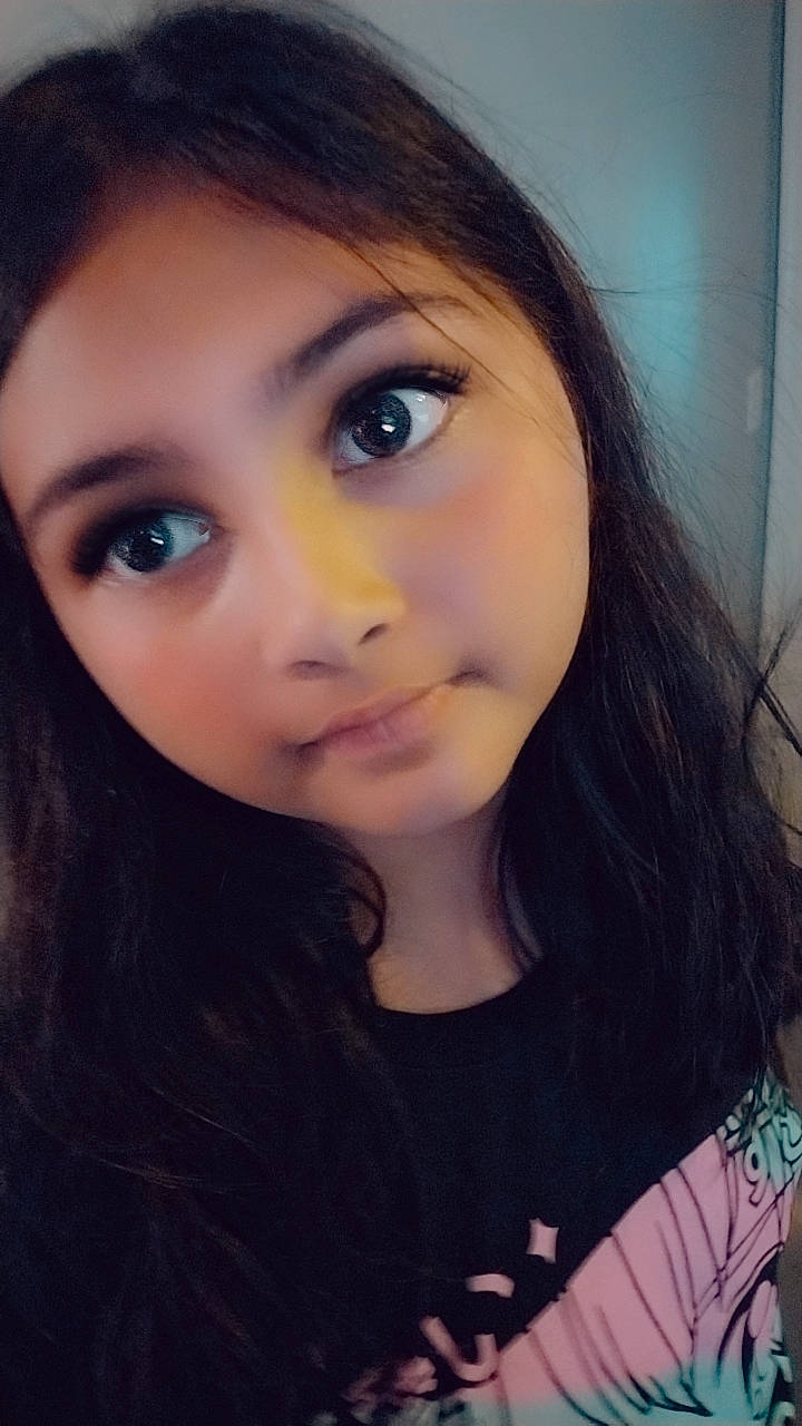 Annabelle is registered to the contest to win money with this photo: bangs, black_hair, cheek, cool, eyelash, flash_photography, forehead, gesture, happy, iris, jaw, layered_hair, lip, long_hair, mouth, neck, nose, person, skin, smile