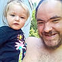 Layla joined the competition — help win amazing prizes! beard, casual, child, clothing, daylight, expression, face, family, hair, happy, holding, man, nature, outdoor, person, portrait, shirtless, smile, sunlight, toddler