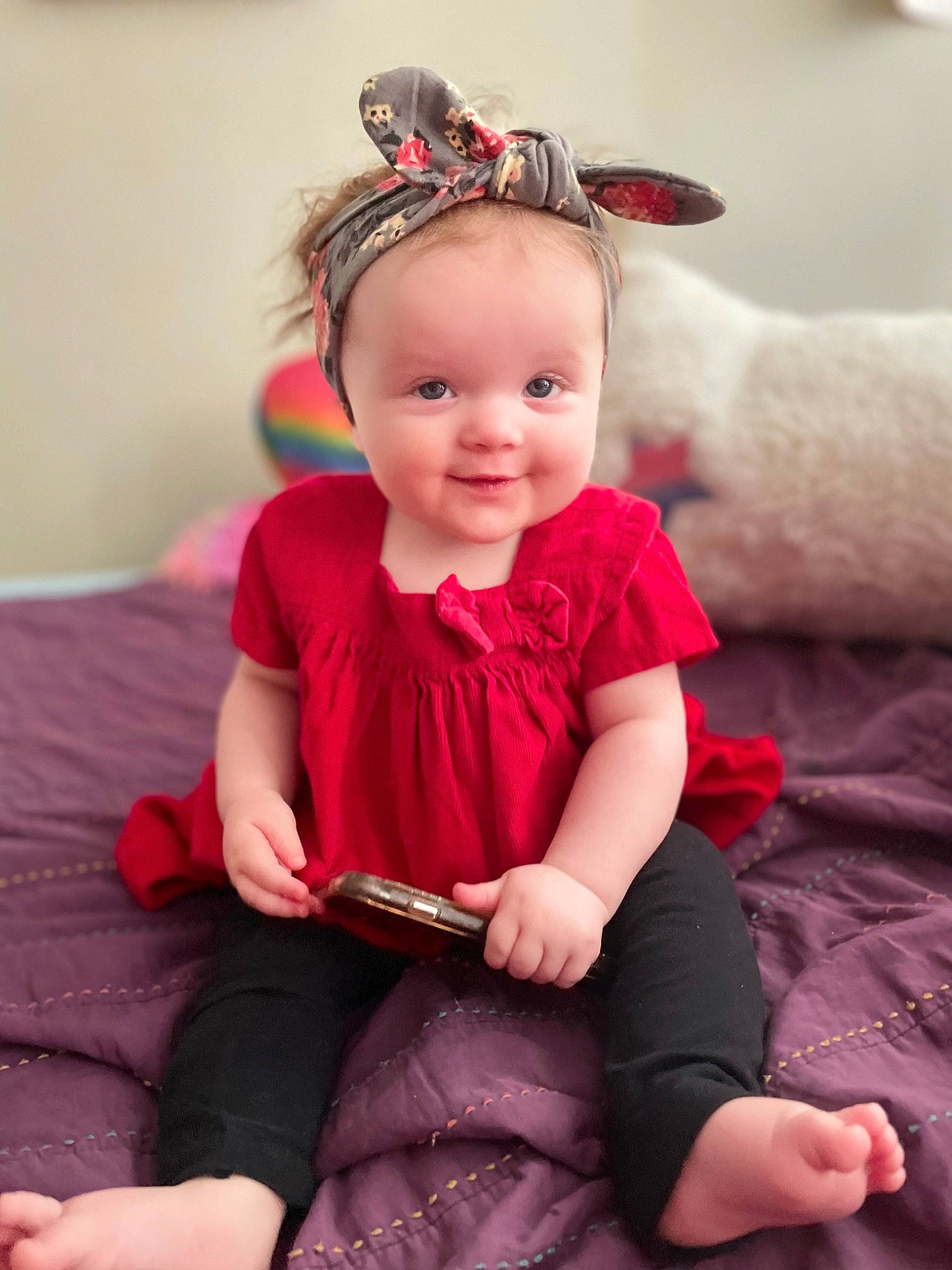 Lilly is registered to the contest to win money with this photo: baby, baby_toddler_clothing, cheek, comfort, event, flash_photography, happy, head, human_leg, joy, lap, magenta, neck, person, pink, purple, red, skin, sleeve, smile