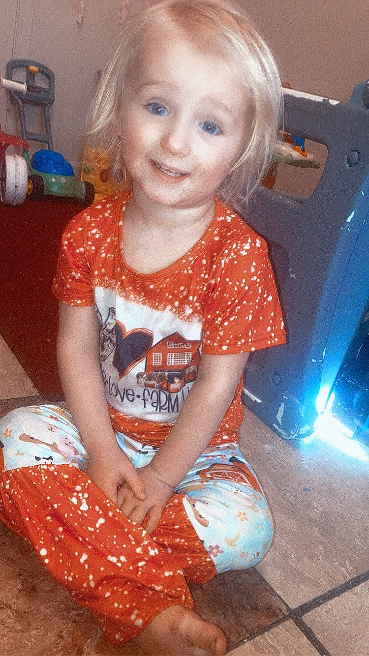 Blakelynn is registered to the contest to win money with this photo: arm, baby_toddler_clothing, blue, cheek, eye, face, facial_expression, hair, hairstyle, happy, head, joint, joy, organ, person, pink, shoulder, skin, sleeve, smile