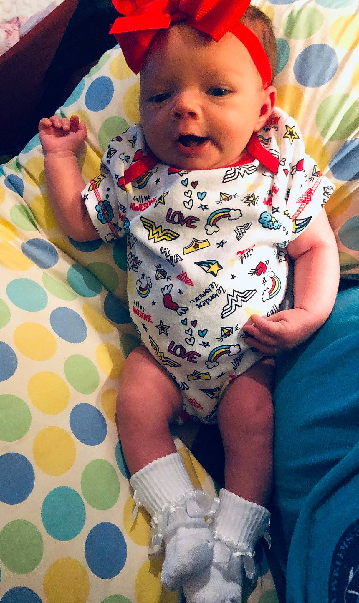 Lacy is registered to the contest to win money with this photo: baby, baby_products, baby_toddler_clothing, cheek, child, daughter, face, fun, head, headgear, lip, pattern, person, play, product, sitting, skin, sleeve, smile, toddler