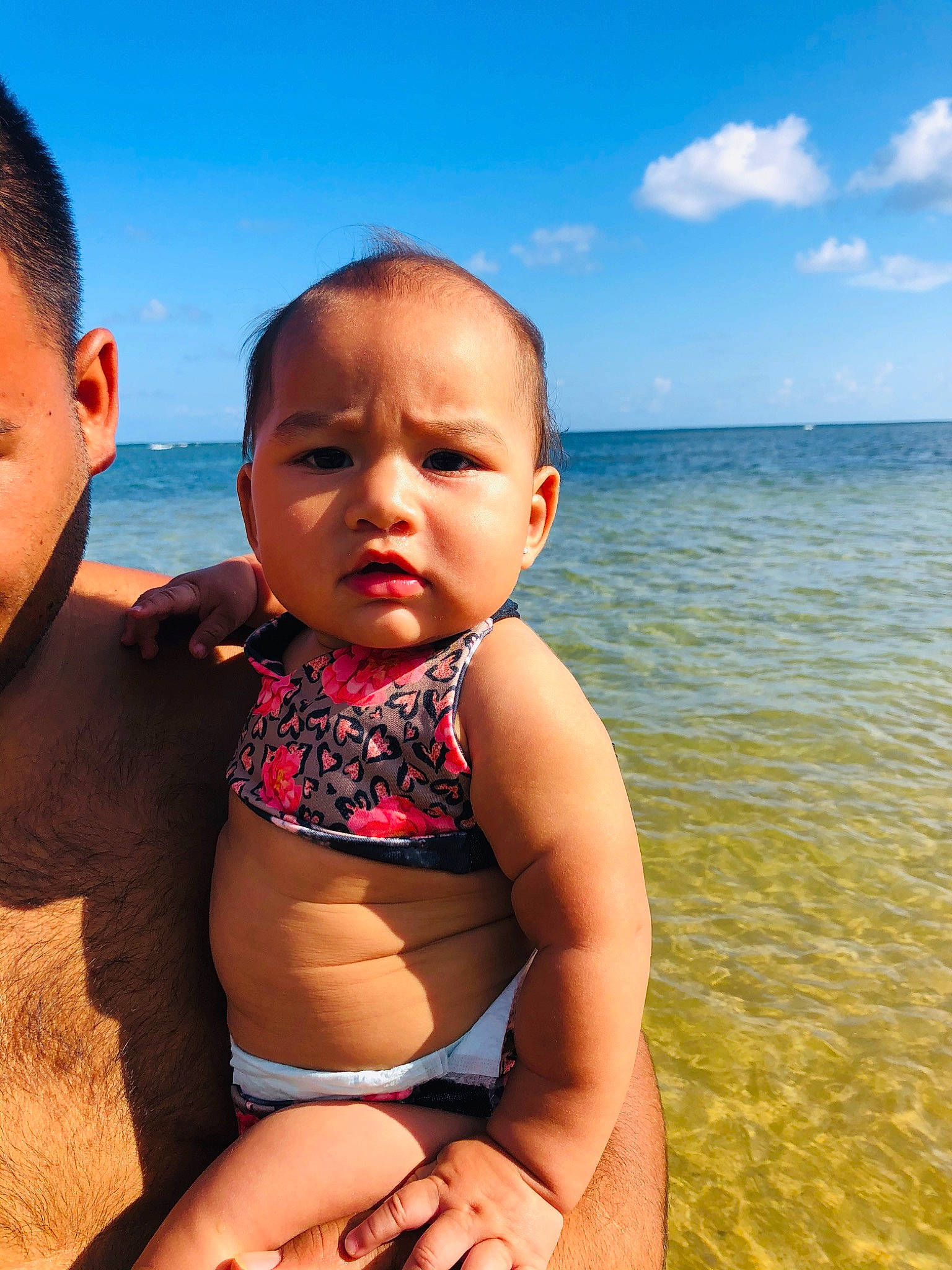 Kealohi is registered to the contest to win money with this photo: baby, beach, blue, brassiere, chest, cloud, happy, leisure, muscle, people_in_nature, people_on_beach, person, skin, sky, stomach, summer, swimwear, thigh, toddler, trunk