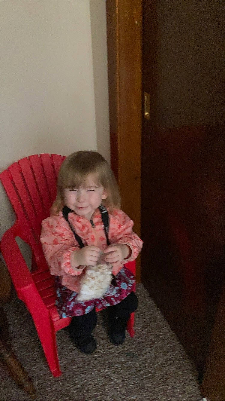 Alice is registered to the contest to win money with this photo: baby, baby_toddler_clothing, chair, cheek, child, comfort, companion_dog, door, flooring, fun, fur, hardwood, joy, lap, leg, person, room, sitting, sleeve, smile