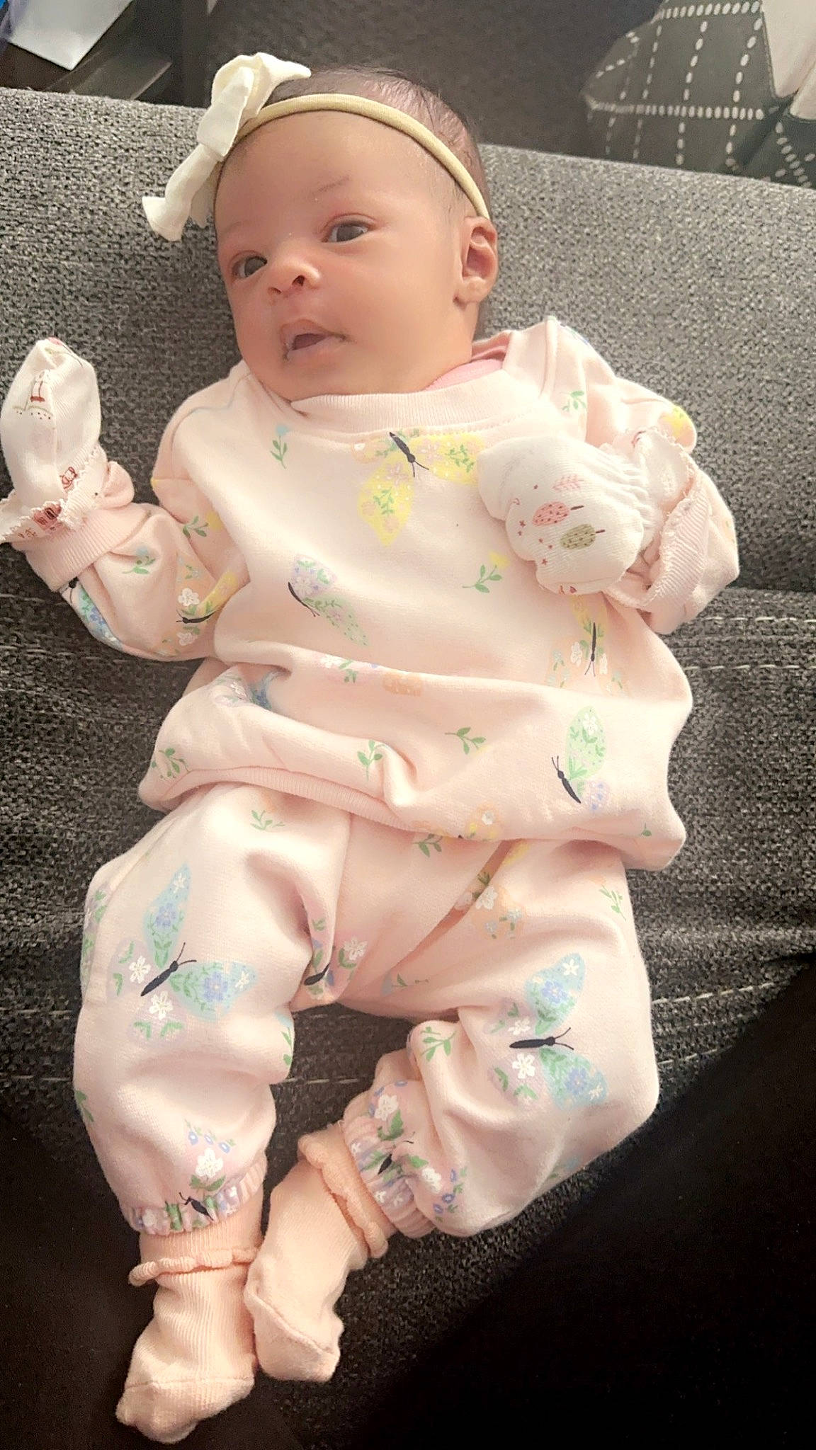 Sakani is registered to the contest to win money with this photo: abdomen, baby, baby_products, baby_toddler_clothing, barefoot, cheek, chest, child, comfort, foot, happy, hat, human_leg, linens, person, pink, sitting, skin, sleeve, thumb