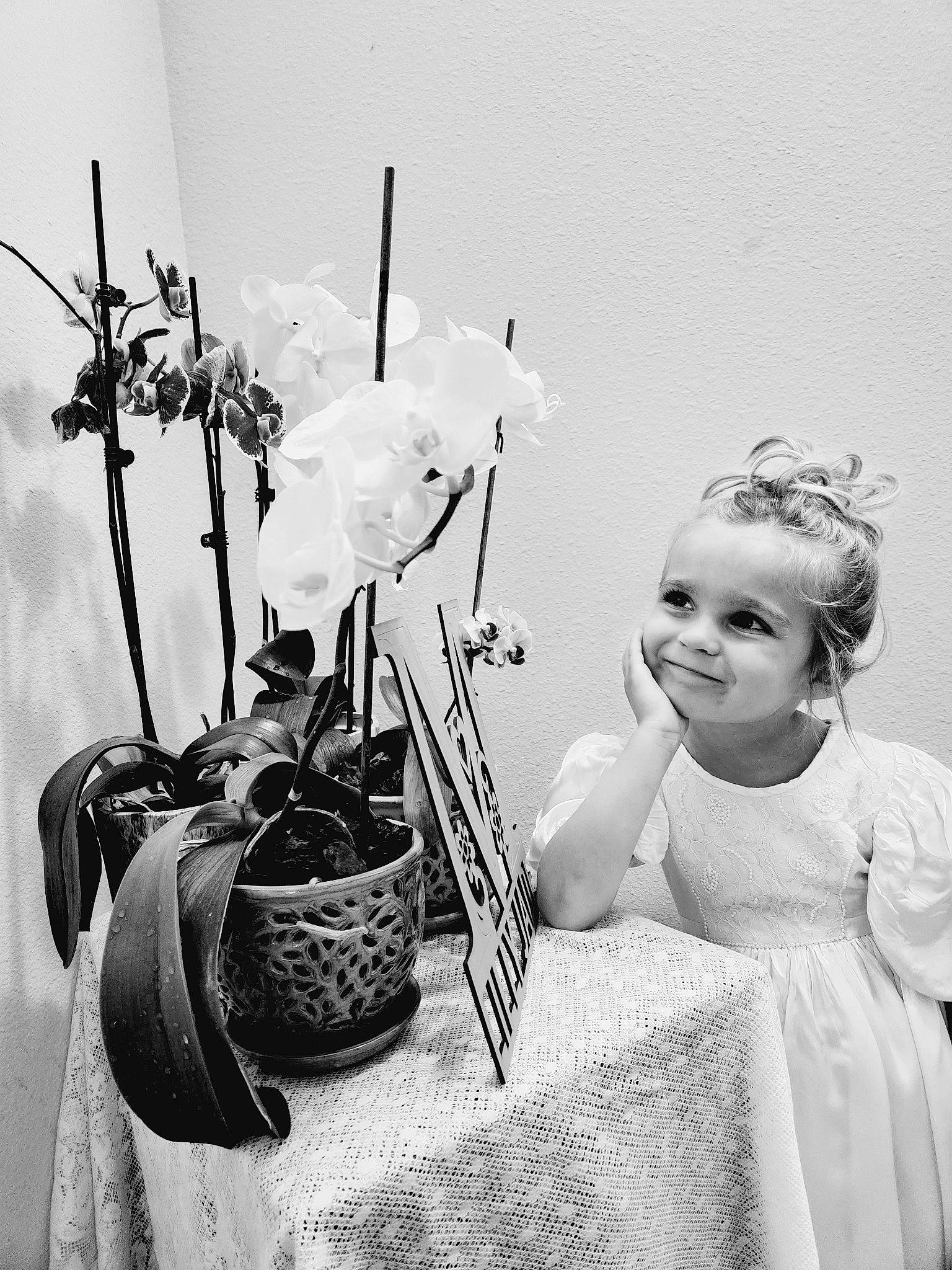 Lillian Jade joined the competition — help win amazing prizes! black_and_white, day_dress, dress, flash_photography, flower, flowerpot, happy, hat, headgear, headpiece, joy, monochrome, monochrome_photography, person, photograph, plant, rose, smile, style, toddler