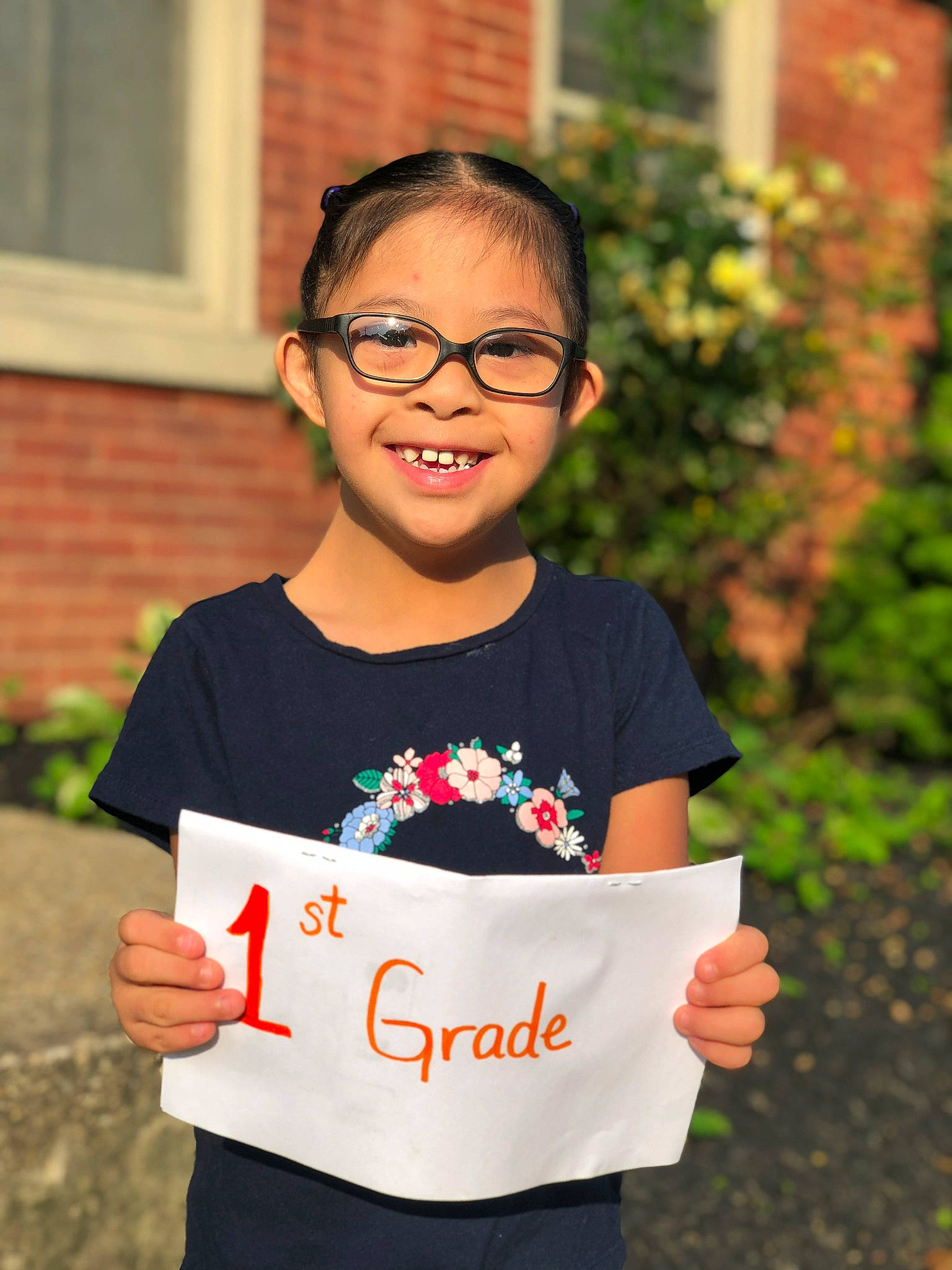 Fanie is registered to the contest to win money with this photo: child, glasses, happy, joy, person, smile, student, t_shirt