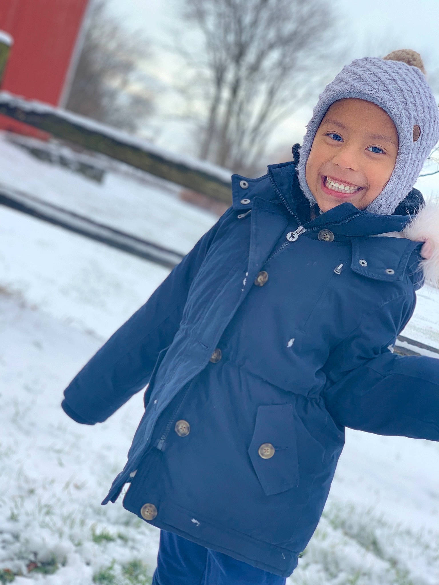 Ashley joined the competition — help win amazing prizes! beanie, blue, cheek, child, coat, electric_blue, eye, freezing, fun, headgear, jacket, joy, knit_cap, outerwear, person, playing_in_the_snow, skin, smile, snow, standing
