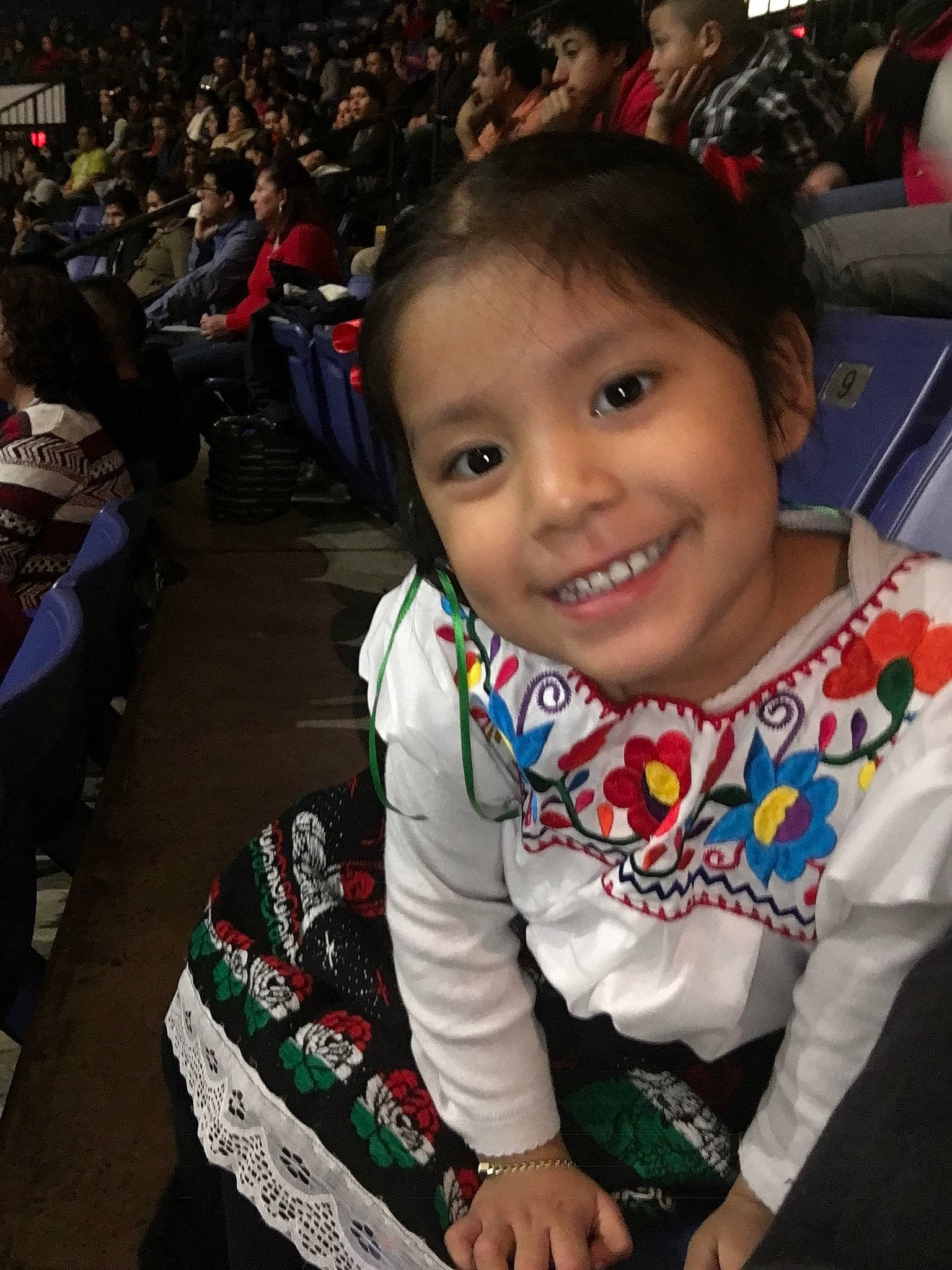 Ashley is registered to the contest to win money with this photo: cheek, child, christmas, face, head, holiday, human, joy, outerwear, people, person, sitting, skin, smile, toddler, world