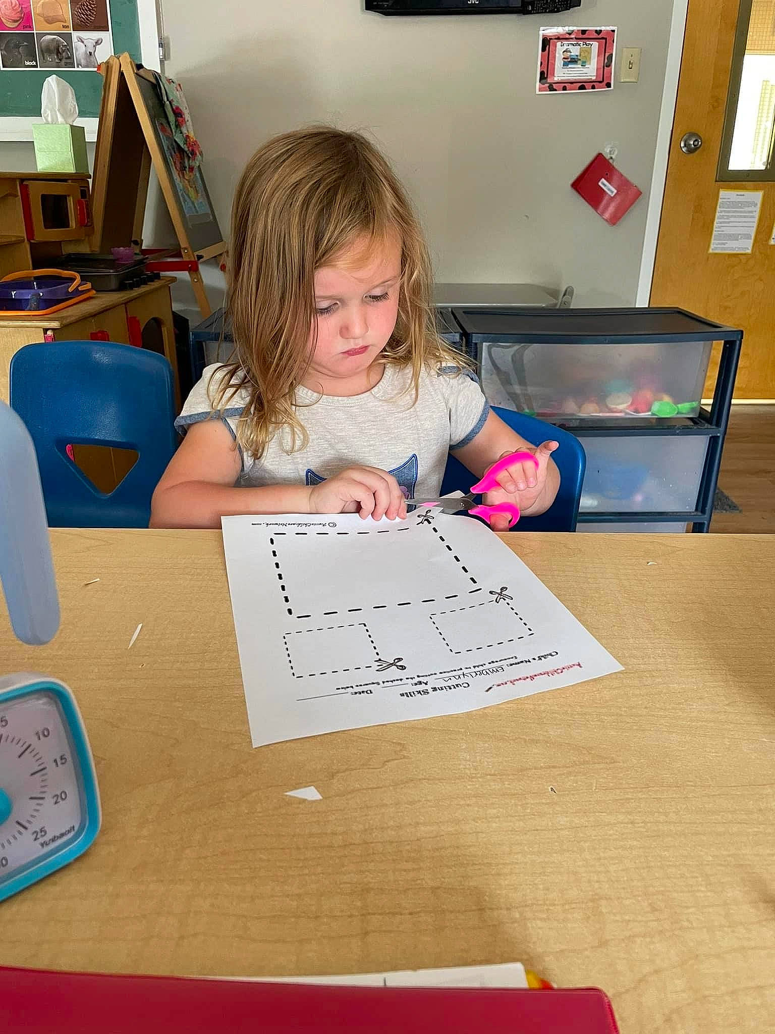 Emberlynn joined the competition — help win amazing prizes! chair, child, curious, desk, education, finger, fun, furniture, handwriting, homework, office_supplies, person, picture_frame, play, stationery, t_shirt, table, toddler, writing, writing_implement