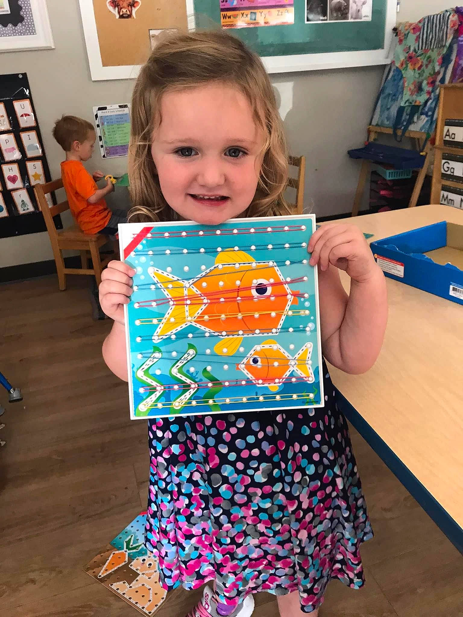 Emberlynn joined the competition — help win amazing prizes! art, baby_toddler_clothing, child, event, flooring, fun, joy, pattern, person, picture_frame, play, recreation, room, shelf, sleeve, smile, spider_man, t_shirt, table, textile