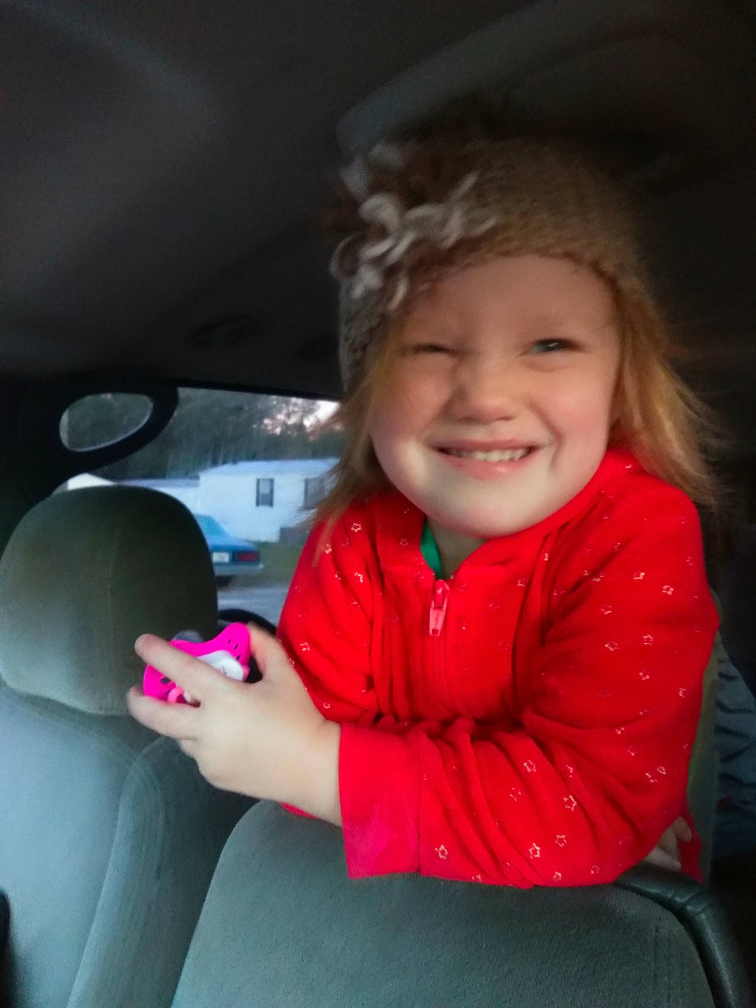 Mackenzie joined the competition — help win amazing prizes! cheek, child, cool, day, emotion, eye, face, fun, girl, hand, head, human_hair_color, joy, mouth, person, pink, red, sitting, skin, smile