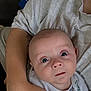 Kai joined the competition — help win amazing prizes! baby, infant, person, arm, clothing, shirt, face, eyes, skin, expression, child, casual, holding, closeup, human, cute, indoor, parent, newborn, curious