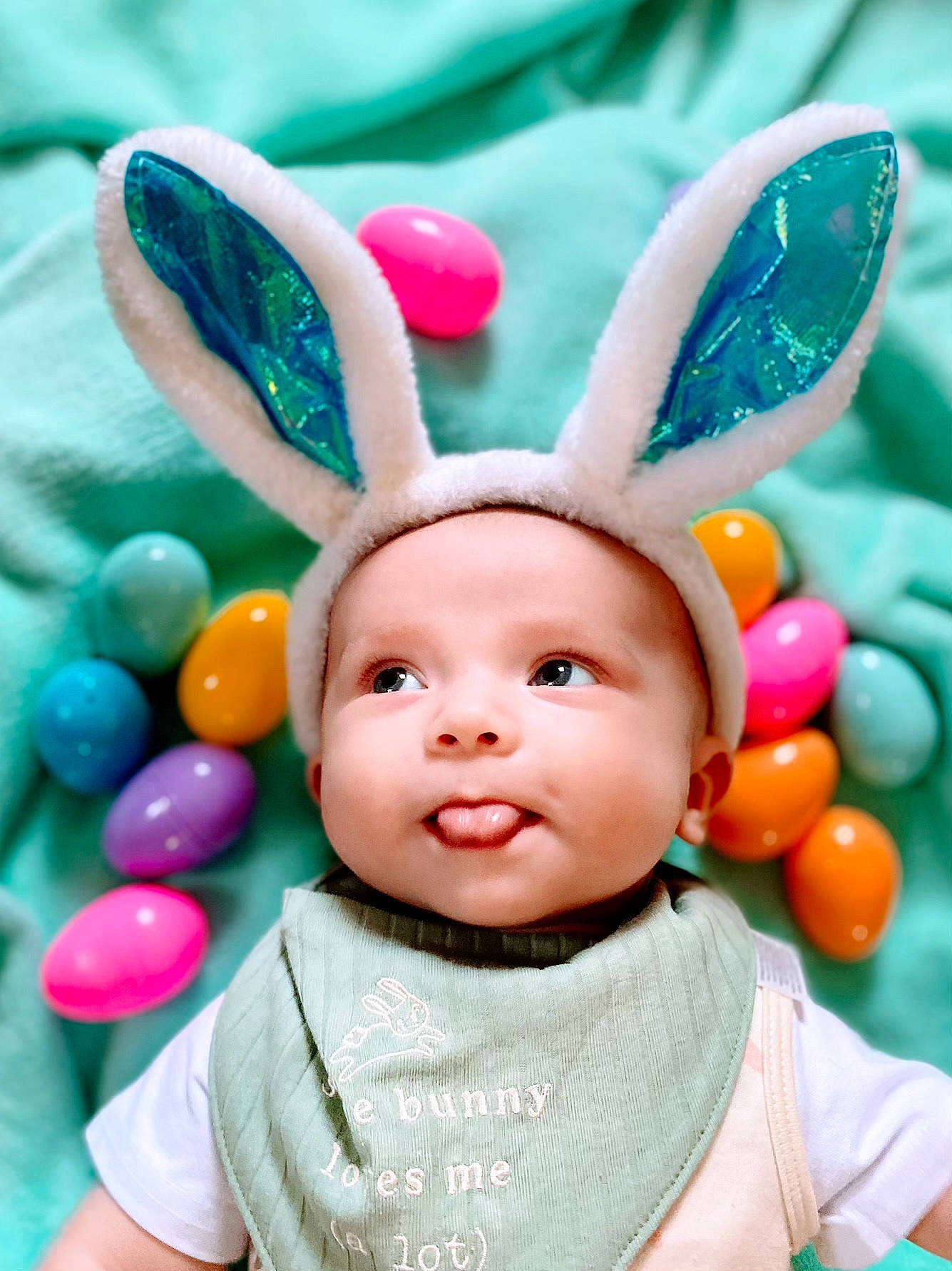 Casen is registered to the contest to win money with this photo: baby, baby_toddler_clothing, child, ear, fawn, green, happy, head, headwear, human_body, magenta, nose, organ, party_supply, people, person, photograph, pink, skin, sleeve