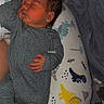 baby, newborn, sleeping, onesie, pillow, dinosaur, towel, bed, infant, cute, sleep, child, cozy, soft, hand, foot, fabric, pattern, indoor, rest
