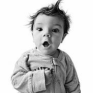 Mikah is registered to the contest to win money with this photo: baby, child, infant, portrait, black_and_white, expression, hair, onesie, cute, surprised, face, wide_eyes, clothing, young, person, studio, monochrome, closeup, hands, sleeves