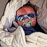 baby, blanket, cheeks, chin, closeup, cozy, cute, fabric, hood, infant, outdoor, pacifier, portrait, quilt, reflection, sleepy, soft_toy, stroller, sunglasses, sunshade