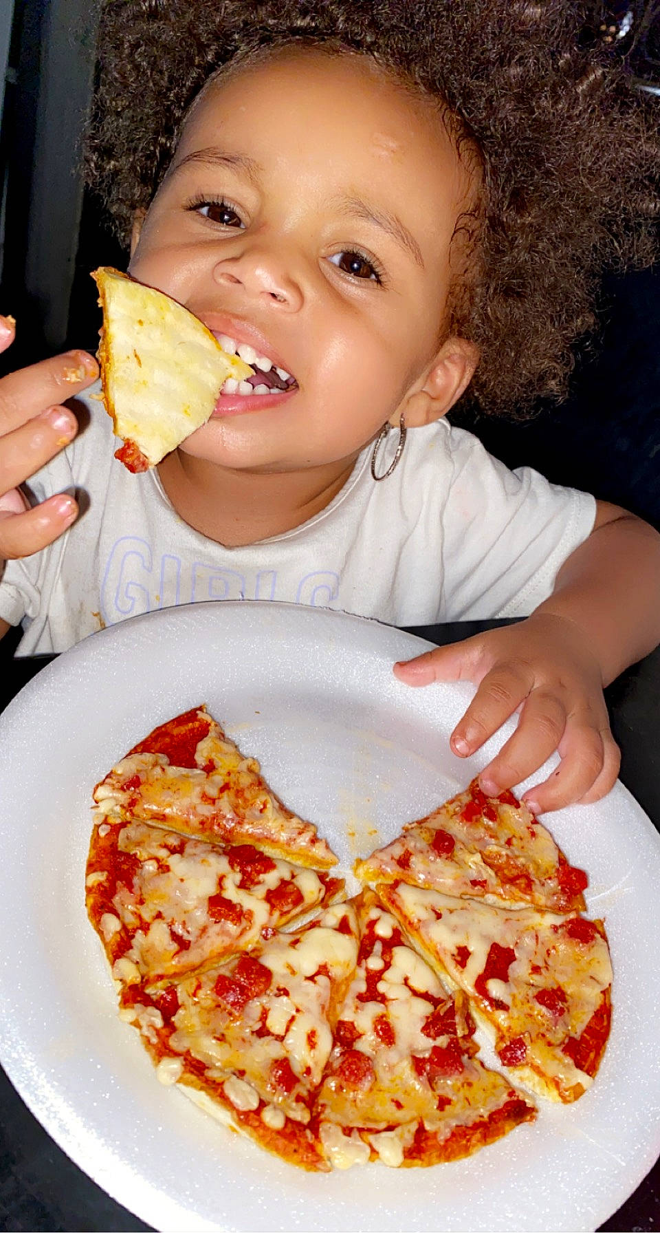 Amina is registered to the contest to win money with this photo: biting, california_style_pizza, child, comfort_food, cuisine, dish, fast_food, finger_food, food, food_craving, ingredient, junk_food, person, pizza, pizza_cheese, produce, recipe, sharing, tableware, toddler