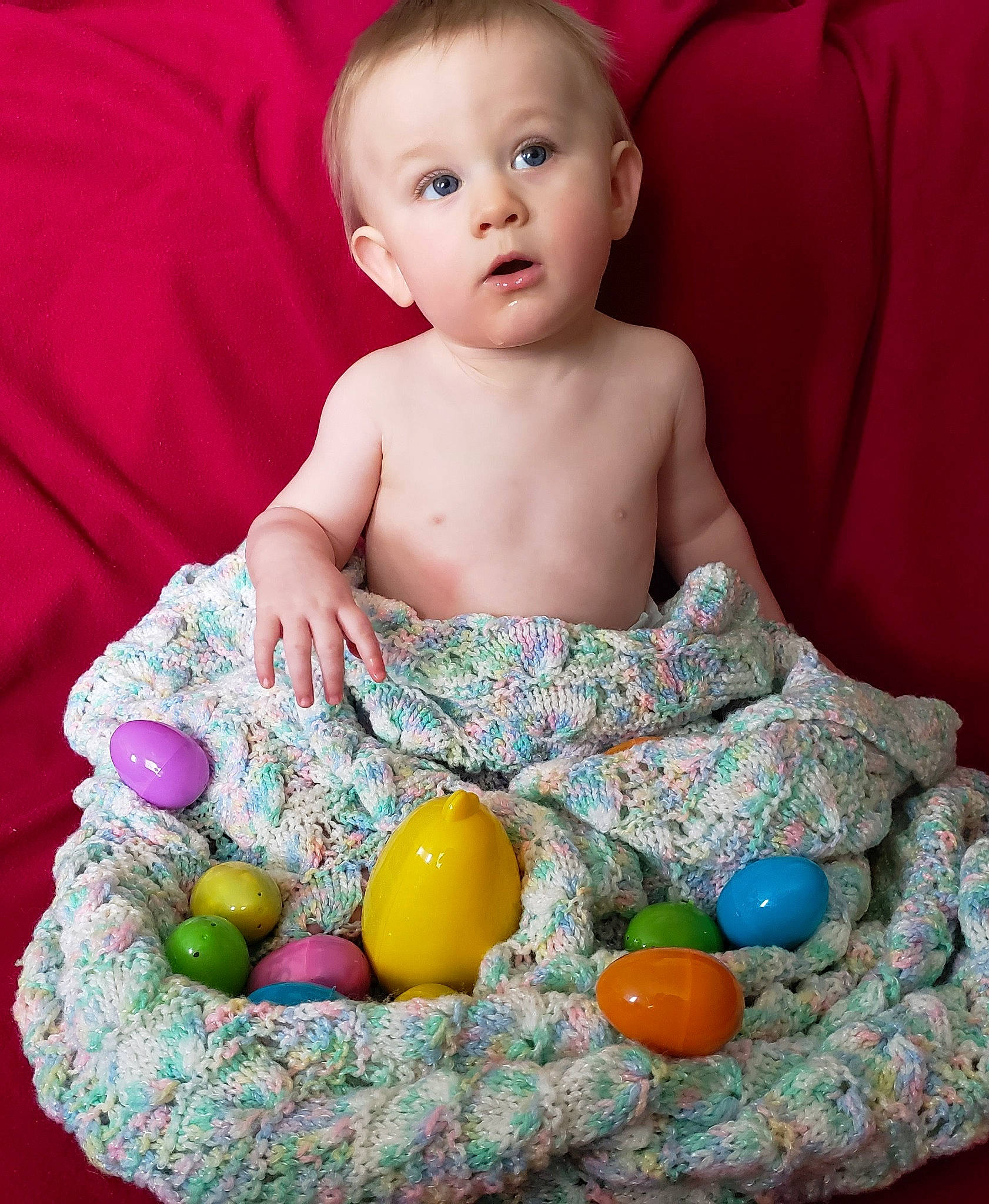 Holden is registered to the contest to win money with this photo: baby, baby_toddler_clothing, baby_toys, child, easter, person, play, sitting, surprise, toddler, toy
