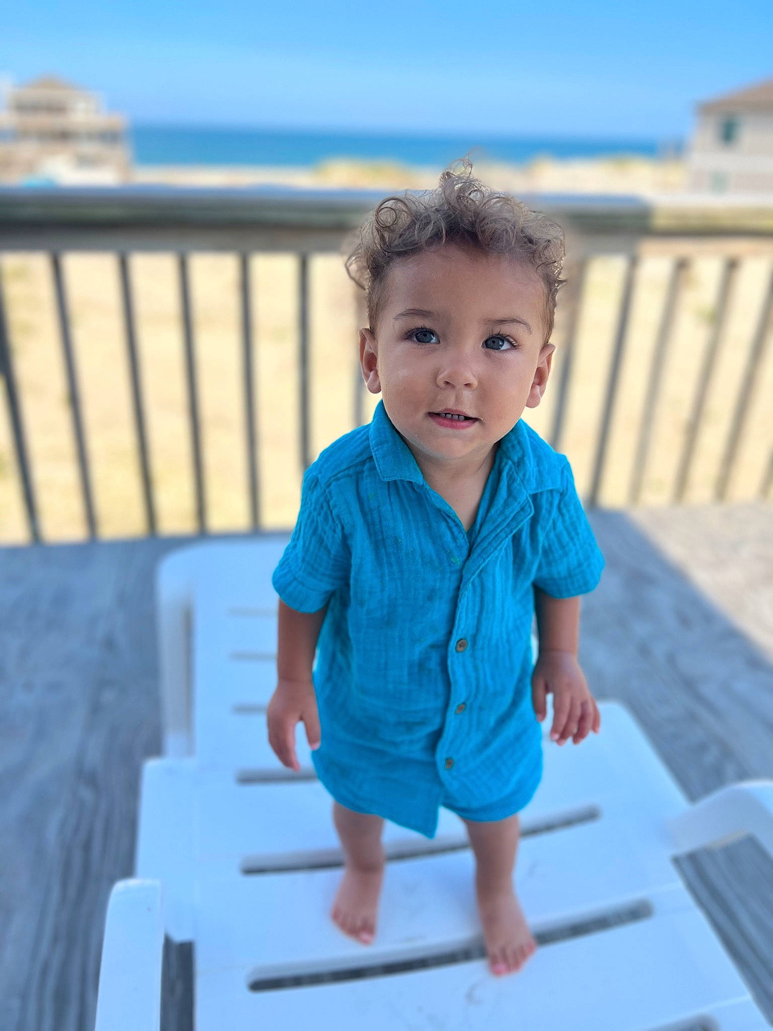 Mateo joined the competition — help win amazing prizes! azure, baby, baby_toddler_clothing, child, electric_blue, eye, fun, hair, happy, leisure, ocean, pattern, person, recreation, sitting, sky, sleeve, t_shirt, toddler, travel