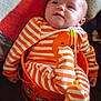 baby, bucket, child, childhood, costume, cozy, cute, face, festive, halloween, holiday, indoor, infant, onesie, orange, plush, sitting, smiling, soft_blanket, striped_clothing