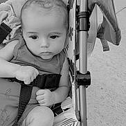 Robert joined the competition — help win amazing prizes! baby, child, stroller, infant, seatbelt, patterned_fabric, outdoor, concrete, hand, face, portrait, monochrome, expression, legs, clothing, sitting, closeup, person, baby_clothes, safety
