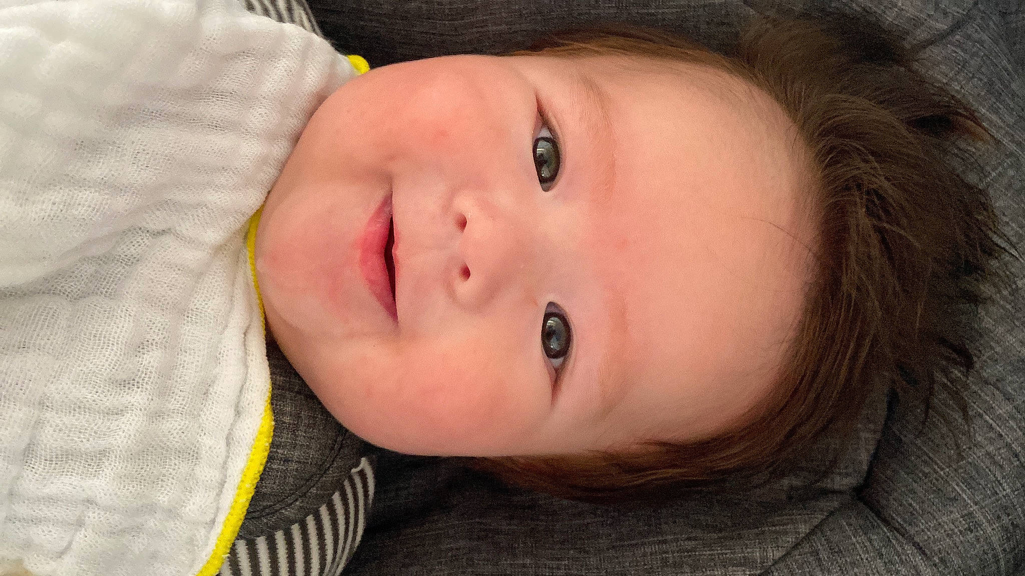 Riley is registered to the contest to win money with this photo: baby, baby_toddler_clothing, cheek, child, chin, close_up, comfort, eyebrow, eyelash, flash_photography, grass, happy, iris, lip, nose, person, portrait_photography, skin, smile, toddler