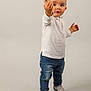 toddler, child, boy, standing, white_shirt, blue_jeans, sneakers, nike, casual_clothing, portrait, studio, gesture, curious, expression, footwear, isolated, full_body, young_child, indoor, fashion