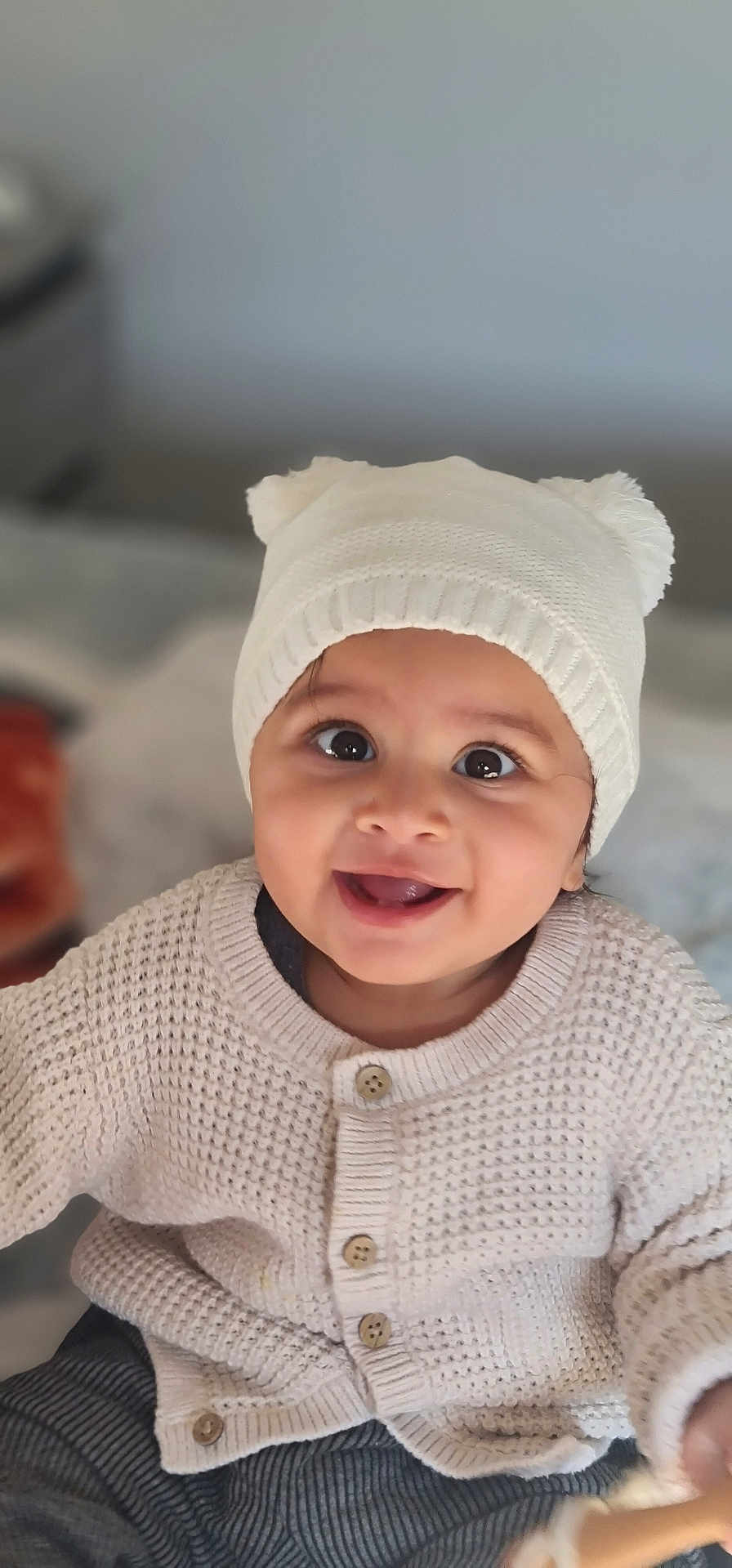 Tabeya joined the competition — help win amazing prizes! baby, button, child, clothing, cozy, cute, expression, face, happy, hat, indoors, infant, knitted, person, pom_pom, portrait, smiling, sweater, warm, white