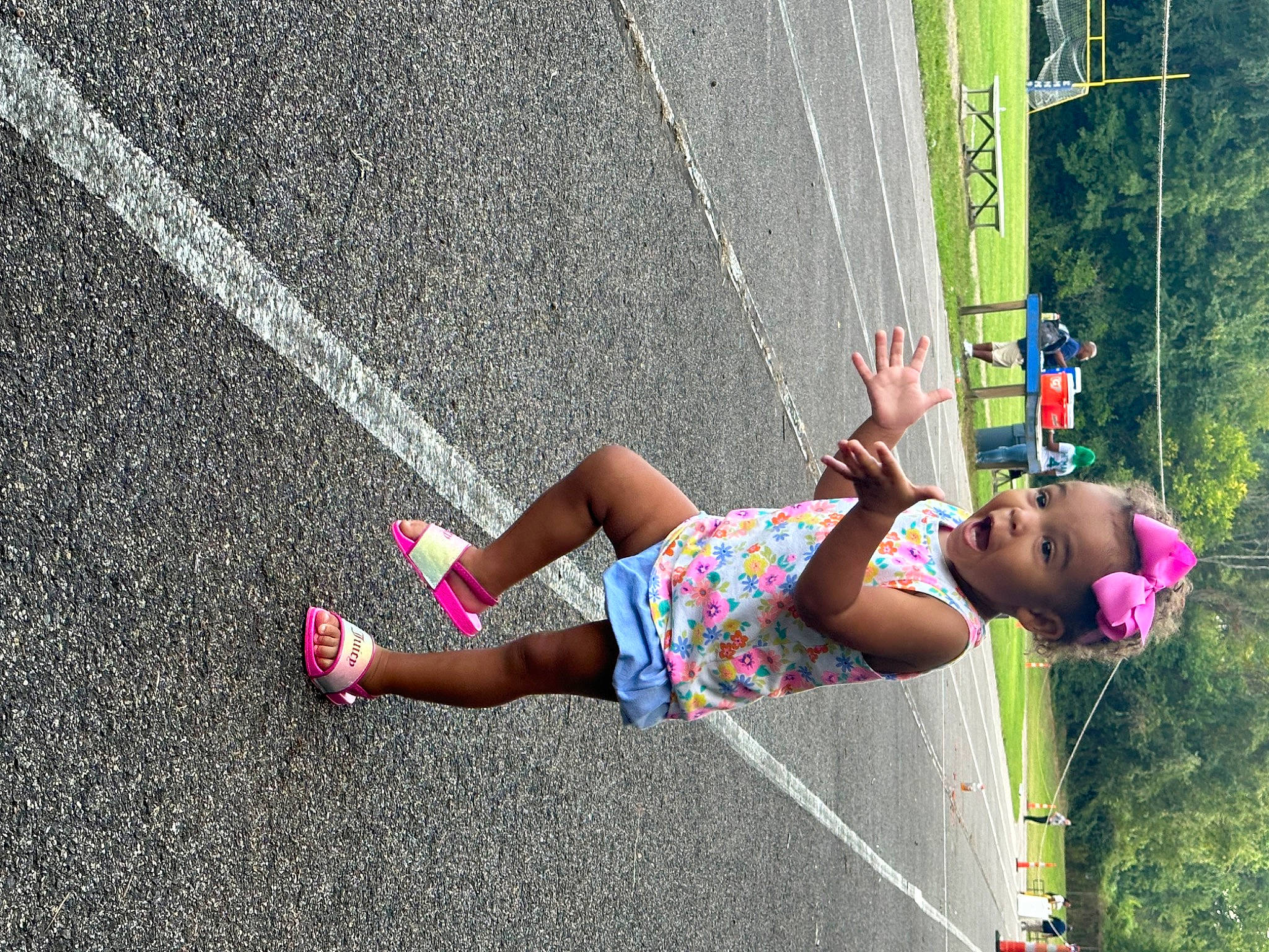 Cali joined the competition — help win amazing prizes! arm, asphalt, calf, footwear, grass, human_leg, knee, leg, leisure, person, pink, plant, recreation, road, road_surface, shorts, sidewalk, surprise, tar, thigh