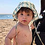 baby, bare_chest, beach, child, curious, hat, holiday, ocean, outdoor, portrait, sand, sea, skin, stroller, summer, sunhat, sunlight, sunny, vacation, water