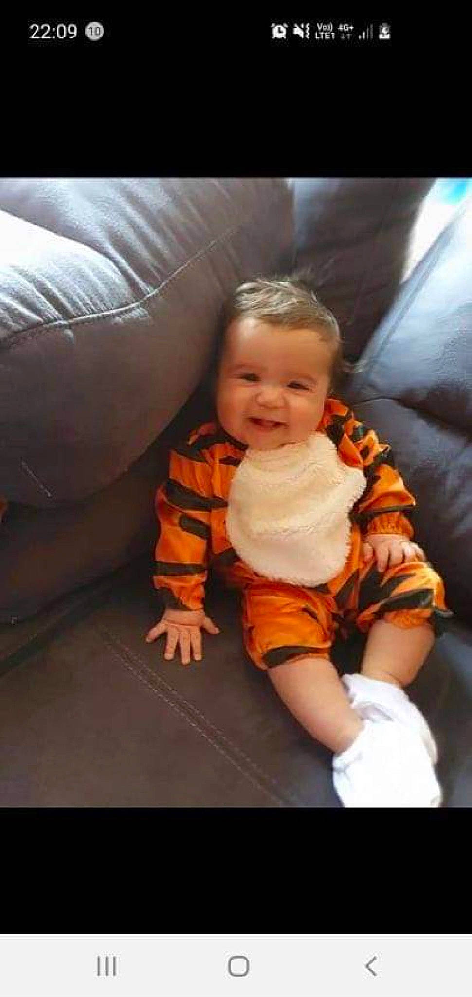 Sacha participe au concours pour gagner de l'argent avec cette photo : baby, baby_toddler_clothing, cheek, child, comfort, couch, eye, face, flooring, fun, happy, head, lap, mouth, person, sitting, skin, sleeve, smile, toddler