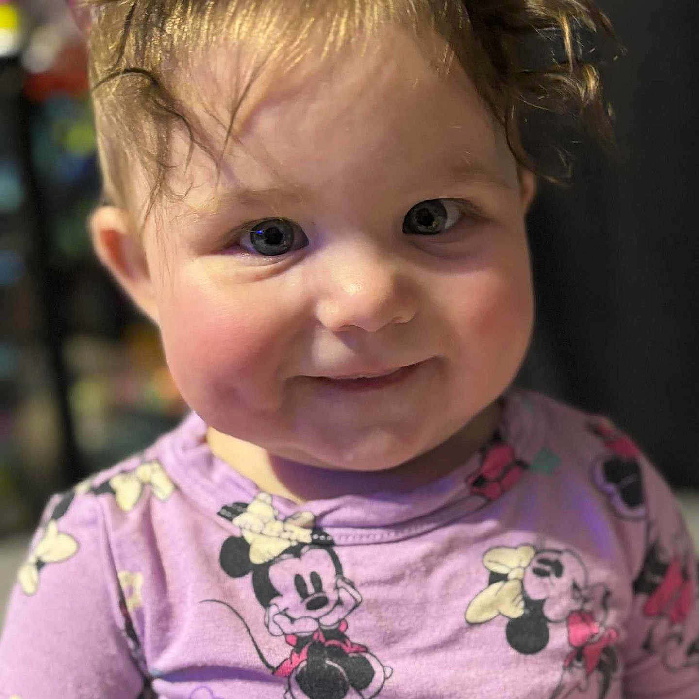 Kinnora joined the competition — help win amazing prizes! apparel, baby, cartoon_print, casual_wear, cheeks, child, closeup, curly_hair, cute, expression, face, happy, indoor, minnie_mouse, person, portrait, purple_clothing, smile, toddler, young_child