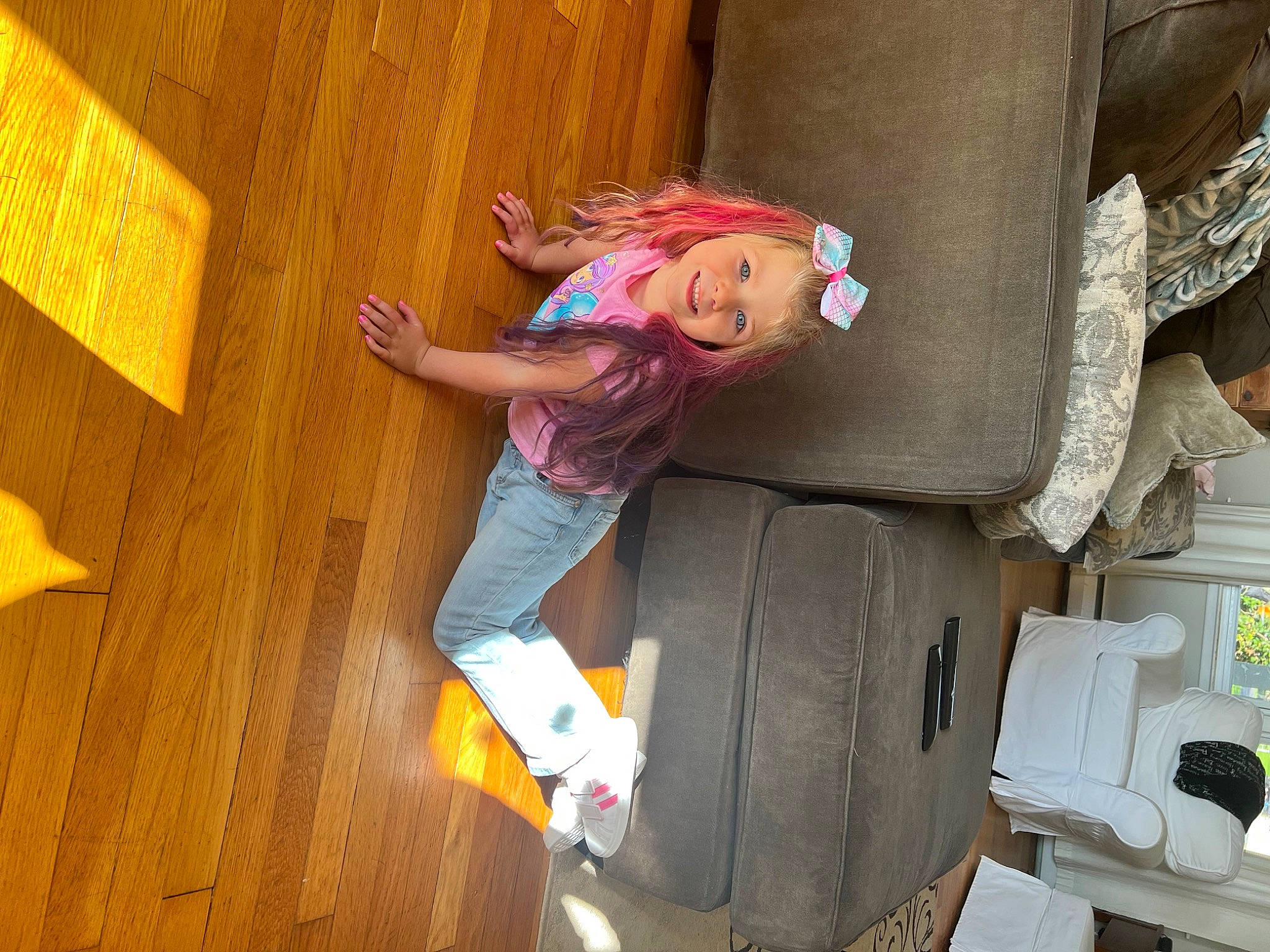 Jacqueline is registered to the contest to win money with this photo: child, flooring, fun, happy, hardwood, joy, leisure, magenta, mammal, person, play, room, sandal, shipping_box, smile, t_shirt, toddler, toy, varnish, vehicle_door