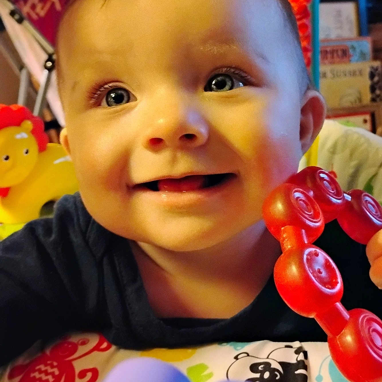 River is registered to the contest to win money with this photo: baby, balloon, bodypart, can, clothing, cream, face, finger, food, hand, happy, head, person, photography, portrait, smile, sweets, t_shirt, tin, toy